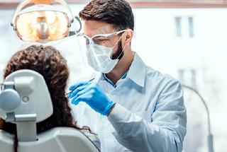Dentist conducting procedure on patient