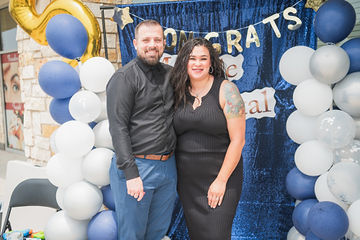 Man and woman in front of Congrats Marble Dental McKinney banner
