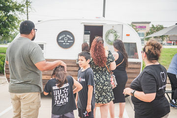 People waiting in line for snow cones