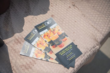 Three brochures sitting on a blanket