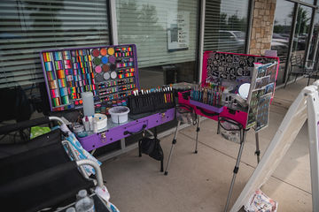 Angled shot of table with tools for face painting