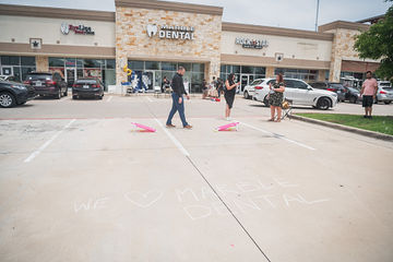 Far shot of beanbag toss game being set up