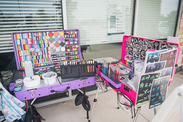 Overhead shot of stations for face paint and tattoos