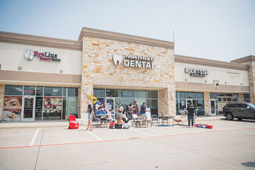 Far shot of celebration happening in front of Marble Dental McKinney