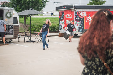 Woman with blonde hair walking through parking lot