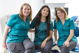 Dental team members smiling