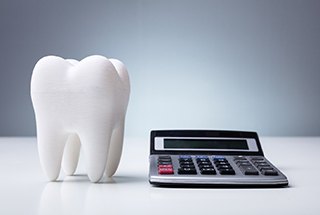 tooth and calculator for cost of cosmetic dentistry in McKinney