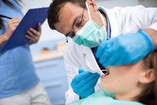 A dentist performing gum recontouring in McKinney