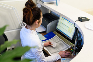 Receptionist working at a desk