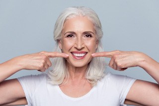 woman smiling about the cost of dentures in McKinney