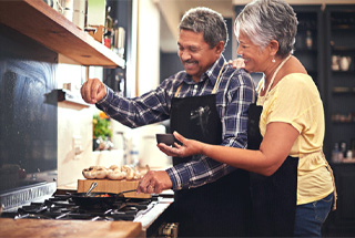 mature couple cooking together