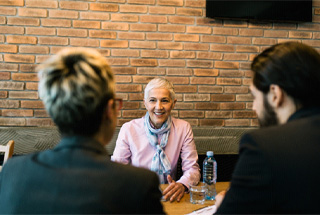mature woman smiling during job interview