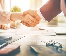 Close up of man and woman shaking hands