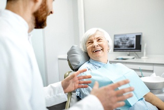 Woman smiling after dental implant salvage in McKinney