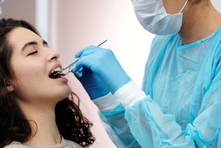 Woman at dentist for full mouth reconstruction in McKinney