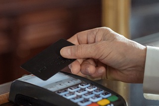 Hand holding credit card for payment