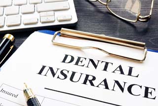 dental insurance paperwork on a clipboard