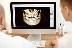Monitor showing computer guided dental implant surgery in McKinney
