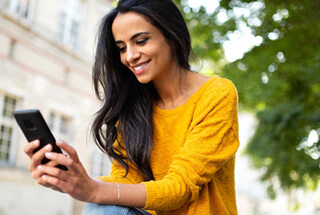 a woman calling her dentist to schedule an appointment