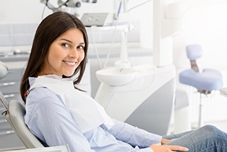 A young woman seated in the chair and preparing to see her sedation dentist in McKinney