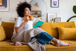 Woman relaxing at home after dental implant procedure