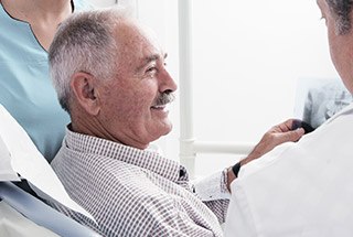 Smiling man in dental chair