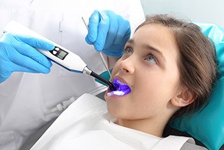 Child receiving dental treatment