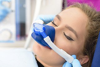 Woman with nitrous oxide mask