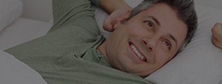 Man sleeping soundly in bed