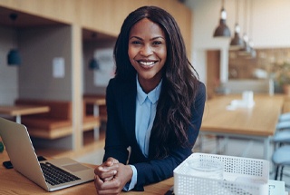 Businesswoman smiling after smile makeover in McKinney