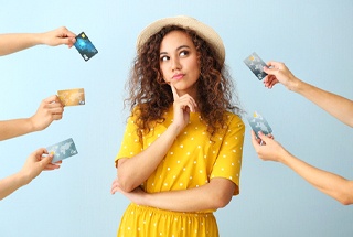 Woman surrounded by credit cards