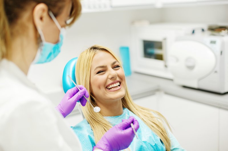 woman smiling in dentist chair