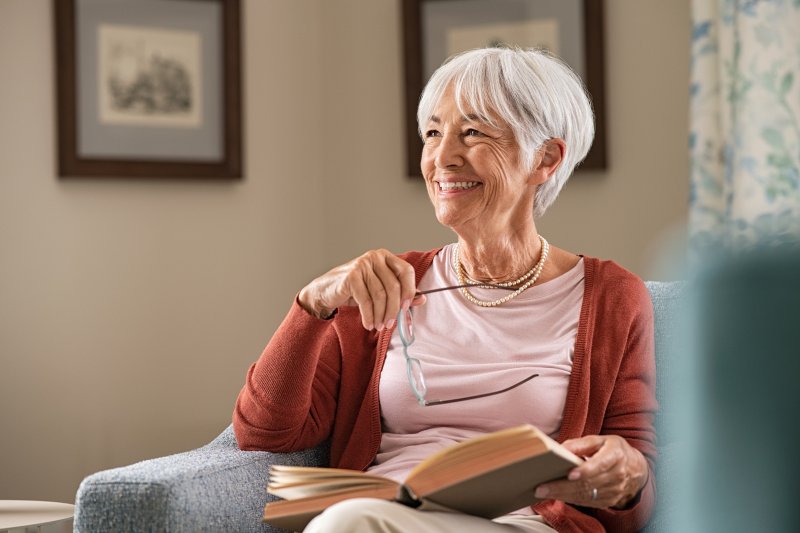 older woman smiling while at home 