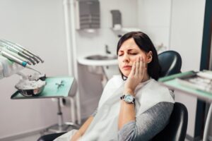 Woman at her dentist with facial pain